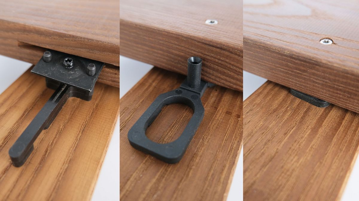 Nahaufnahme von Holzverbindungen und Befestigungselementen auf Holzplanken.